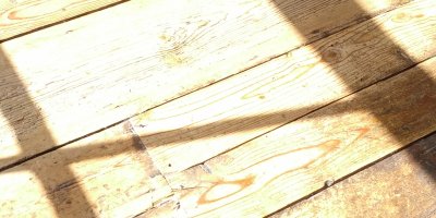 window=-cast shadows on wooden floor